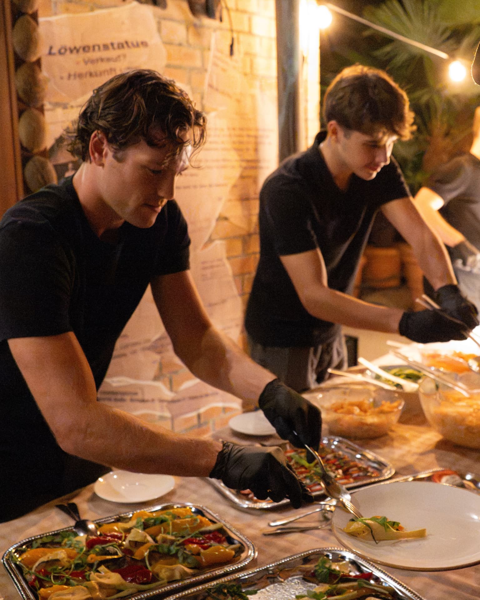 Staff preparing the buffet at a private birthday celebration in the evening